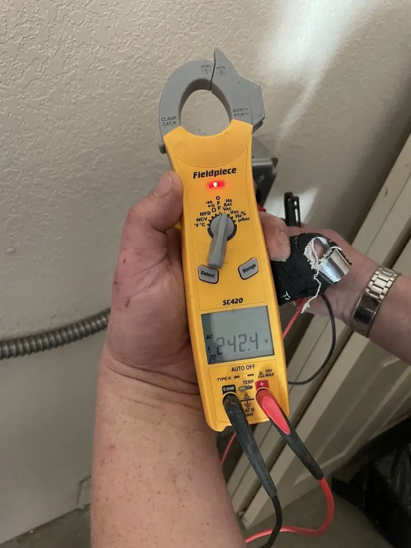 Voltage testing with clamp meter during Recessed Lighting Installation in Sans Souci